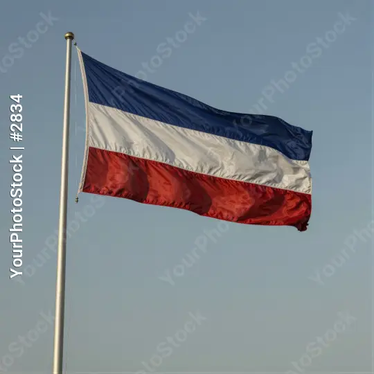 Flag on a Pole Against a Clear Sky