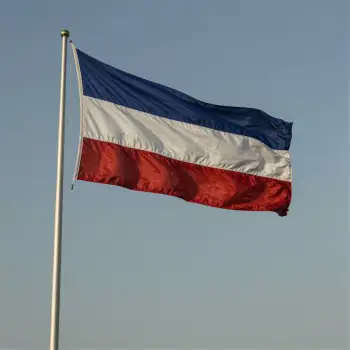 Flag on a Pole Against a Clear Sky