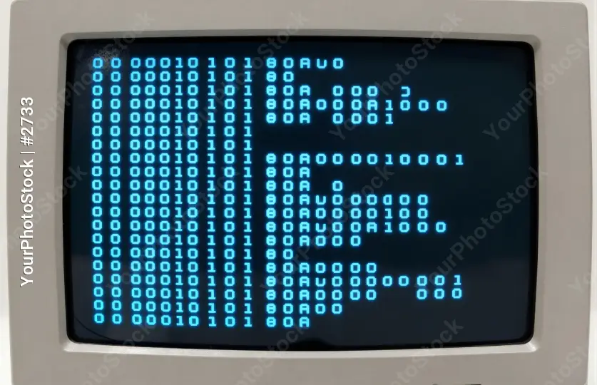Old-fashioned computer with binary code displayed on screen