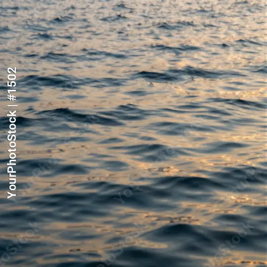 Calm Blue Water Surface at Sunset ripples serene