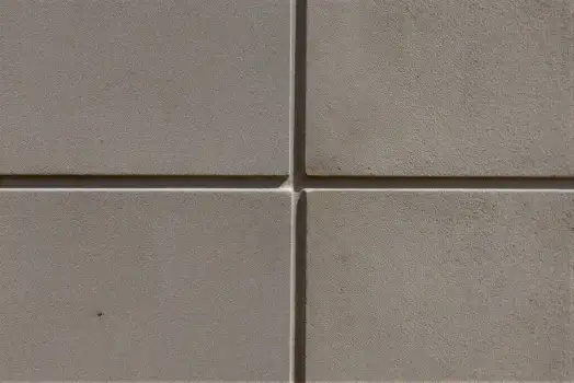 Close-up of Textured Concrete Tiles in Grid Pattern texture