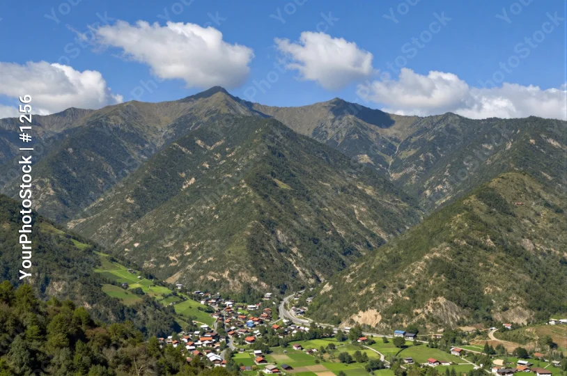 Mountainous Landscape with Town mountains green vegetation