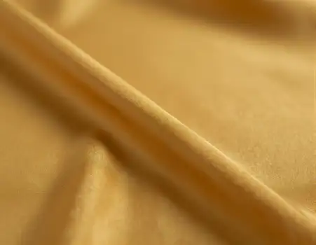 Golden Yellow Silk Fabric Close-Up smooth texture