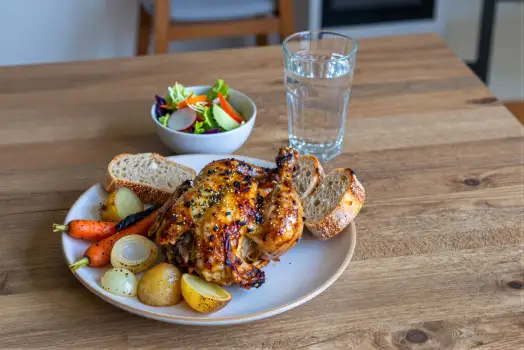 Roasted Chicken with Vegetables on Wooden Table