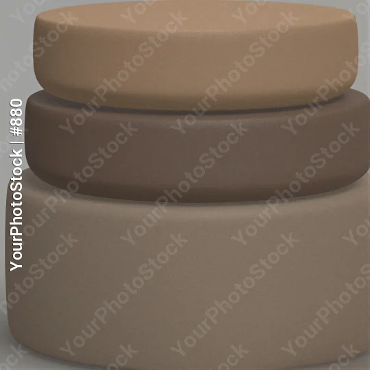 Three cylindrical objects stacked on beige material leather