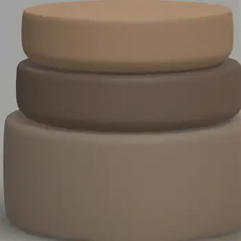 Three cylindrical objects stacked on beige material leather