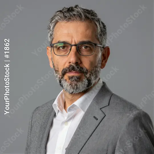 Middle-aged businessman in grey suit headshot