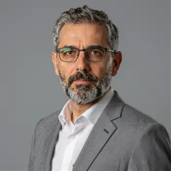 Middle-aged businessman in grey suit headshot