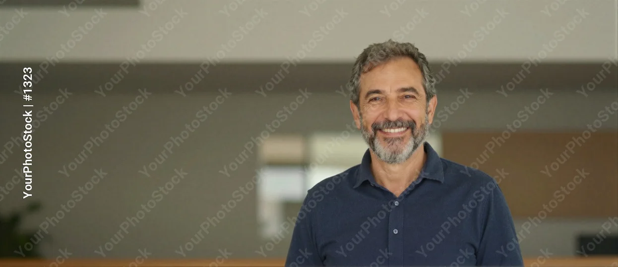 Middle-aged man with beard smiling mustache room business corporate