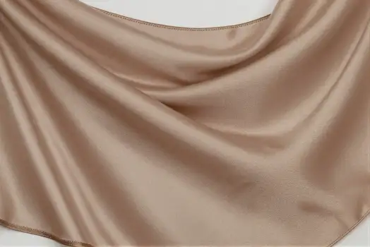 Luxurious Beige Satin Fabric Close-Up smooth sheen