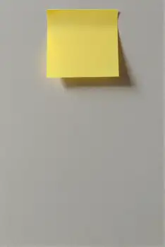 Yellow Post-It Note Floating on White Background sticky note