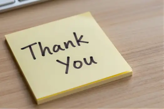 Thank You Sticky Note on Wood with Keyboard wooden surface