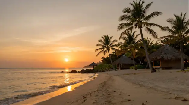 Tropical Beach Sunset palm trees thatched roofs