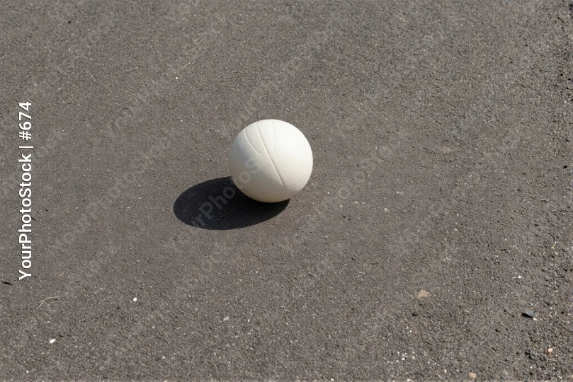 White Volleyball on Gray Asphalt - Sports Equipment