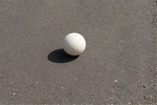 White Volleyball on Gray Asphalt - Sports Equipment