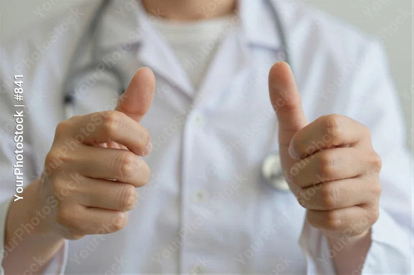 Doctor's Hands Thumbs Up Lab Coat Stethoscope Medical Setting