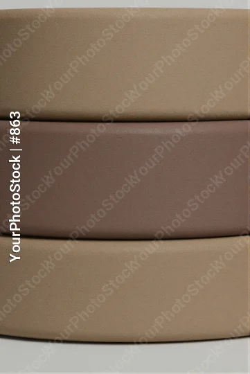 Three Stacked Rectangular Objects on White Background