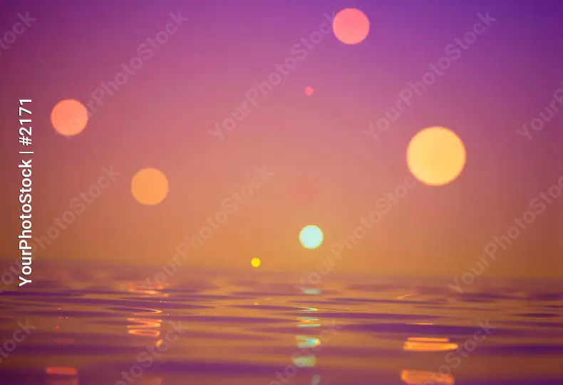 Serene Sunset Over Ocean with Colorful Sky Circles