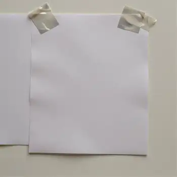 Two Blank White Paper Sheets Hanging on Wall white papers sticky notes