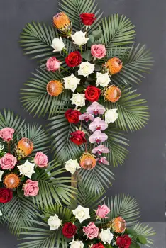 Elegant Cross Flower Arrangement roses carnations