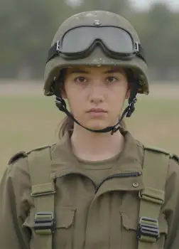 serious military woman in green helmet goggles