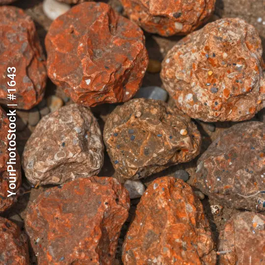 Close-up of Small Rocks with Reddish-Brown Color and Orange Speckles