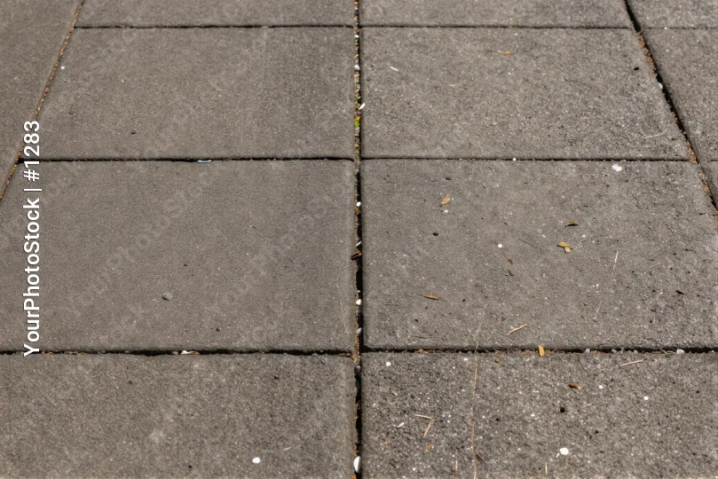 Close-up of Gray Square Pavement Tiles grid overlaps