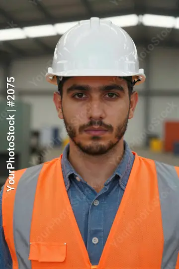 Construction Worker in Warehouse hard hat safety vest