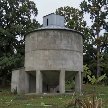 Old Concrete Water Tank with Dome in Overcast Sky
