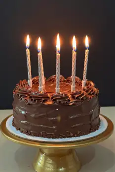 Chocolate Cake with Candles on Gold Stand birthday celebration