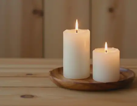 Lit White Candles on Wooden Tray table peaceful