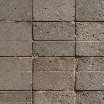 Close-up of a brick wall with grid pattern overlapping bricks texture