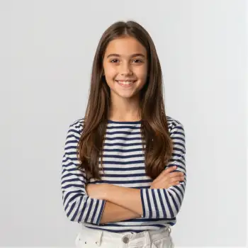 Happy Young Girl Smiling with Arms Crossed portrait