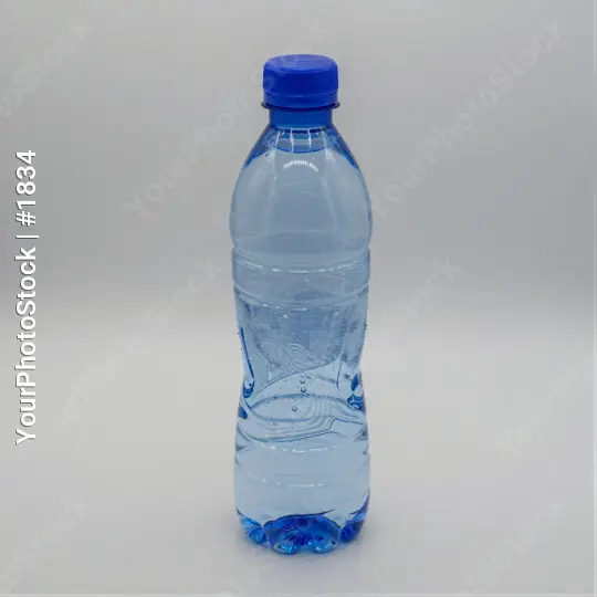 Transparent Water Bottle with Blue Cap on White Background