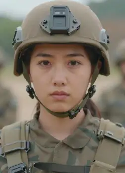 Military Woman Wearing Helmet with Camera - Serious Expression