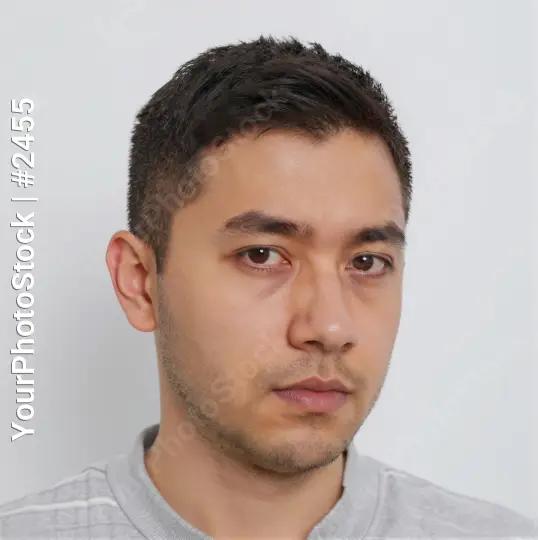 Young Man in Serious Expression Wearing Striped Shirt