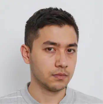 Young Man in Serious Expression Wearing Striped Shirt